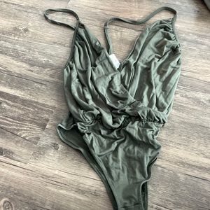 New with tags Urban green bodysuit with crossover front